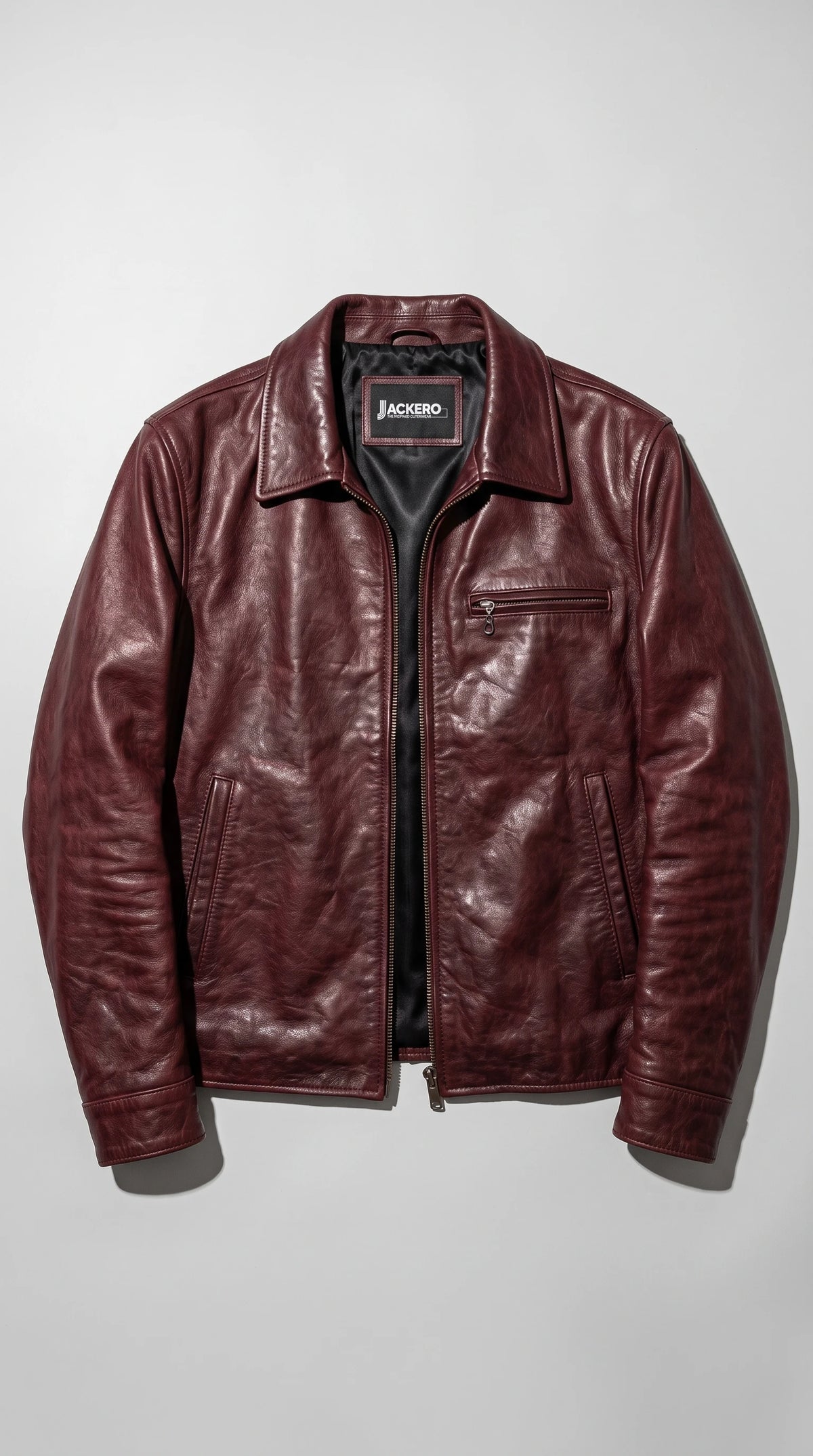 Open burgundy leather jacket showing the quilted inner lining and two inside pockets, an easy layering jacket over shirts, knits or tees for fall outfits and date nights