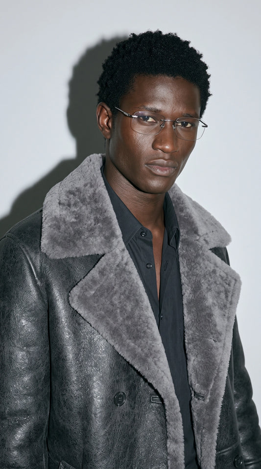 Bring dramatic flair to your winter wardrobe in this engaging Jackero charcoal grey leather trench coat, combining a sleek longline silhouette with cozy faux sherpa for the ultimate streetwear flex.
