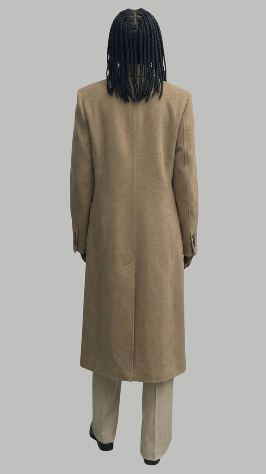 Full-length shot showcasing the classic silhouette long camel wool coat.