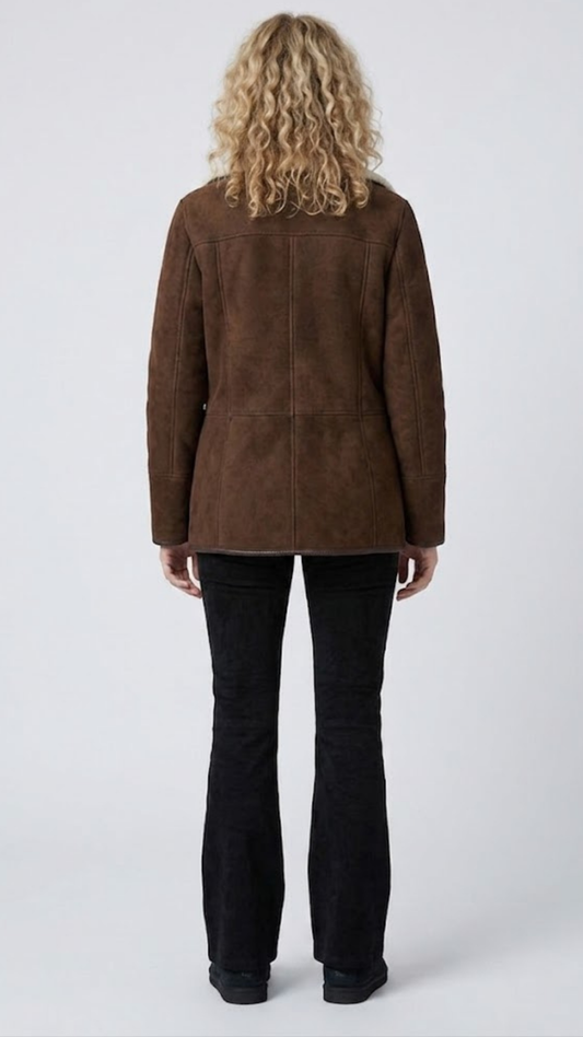 Regular fit dark chocolate brown suede outerwear styled over a dark turtleneck sweater for an elegant winter look.