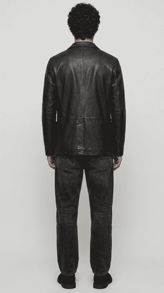 back-angle profile of a regular fit black leather dinner jacket displaying smooth drape and premium leather material quality.