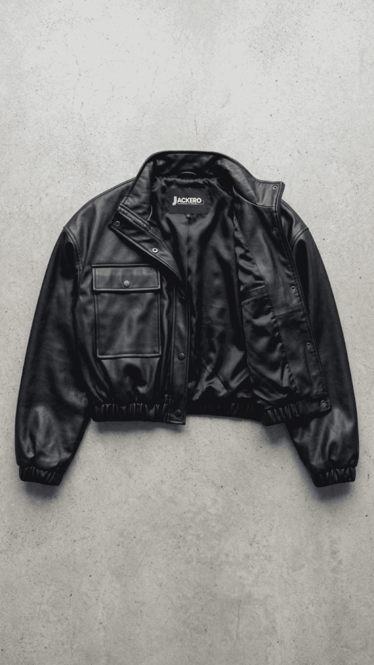 Jackero contemporary black leather cropped jacket beautifully presented against a clean, minimalist studio backdrop.