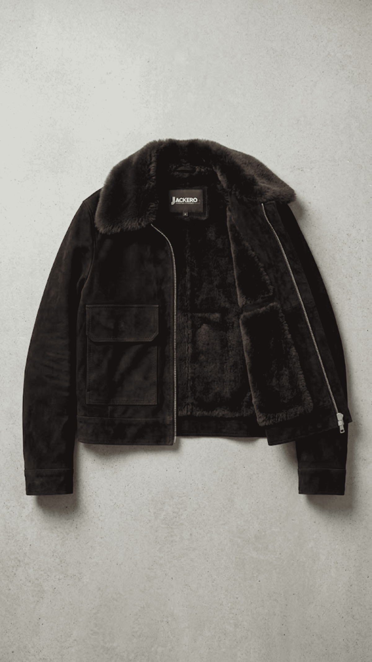 Jackero contemporary dark black suede jacket with dark chocolate shearling beautifully presented against a clean, minimalist studio backdrop.
