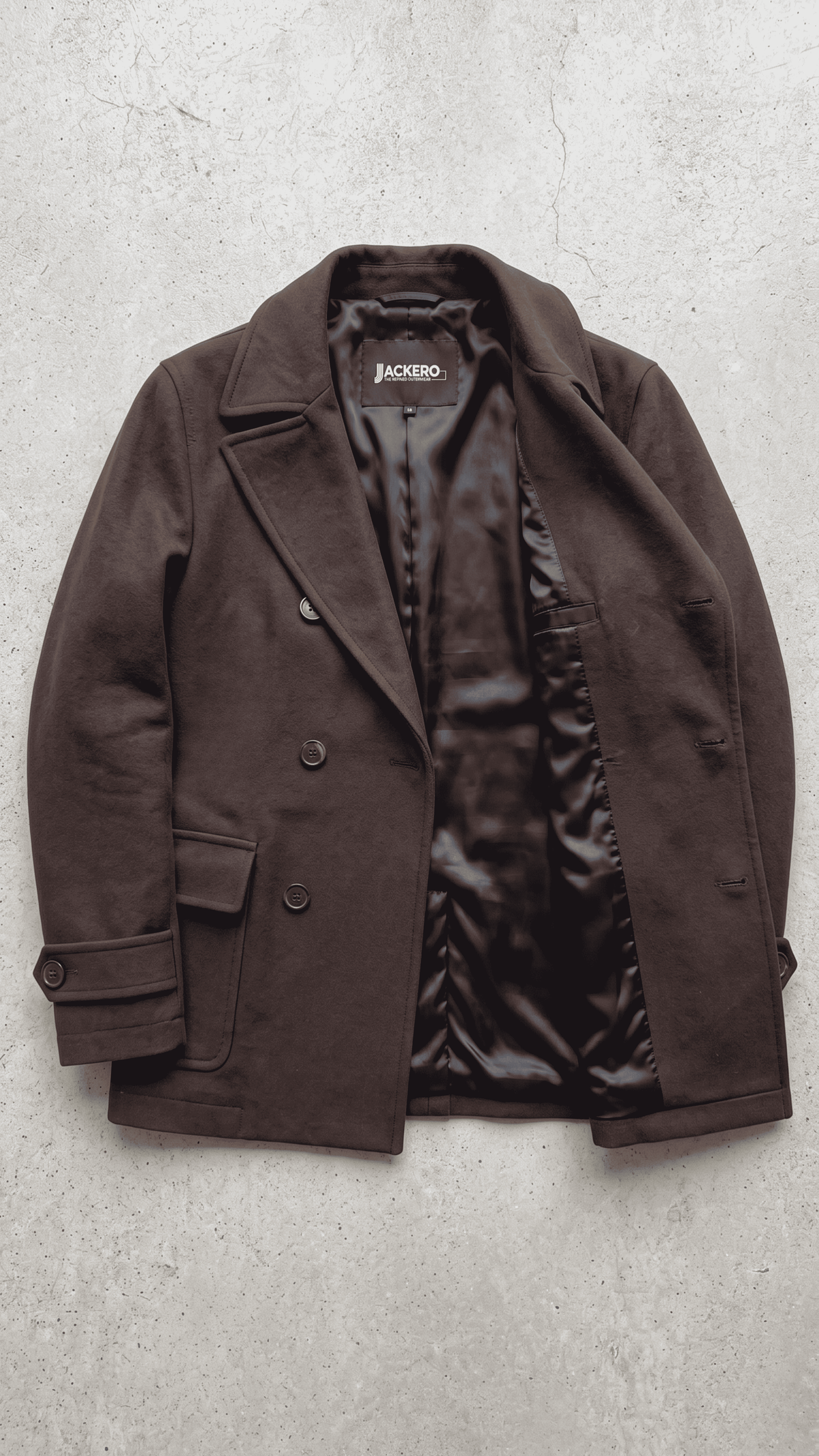 Jackero dark chocolate brown wool overcoat beautifully presented against a clean, minimalist studio backdrop.