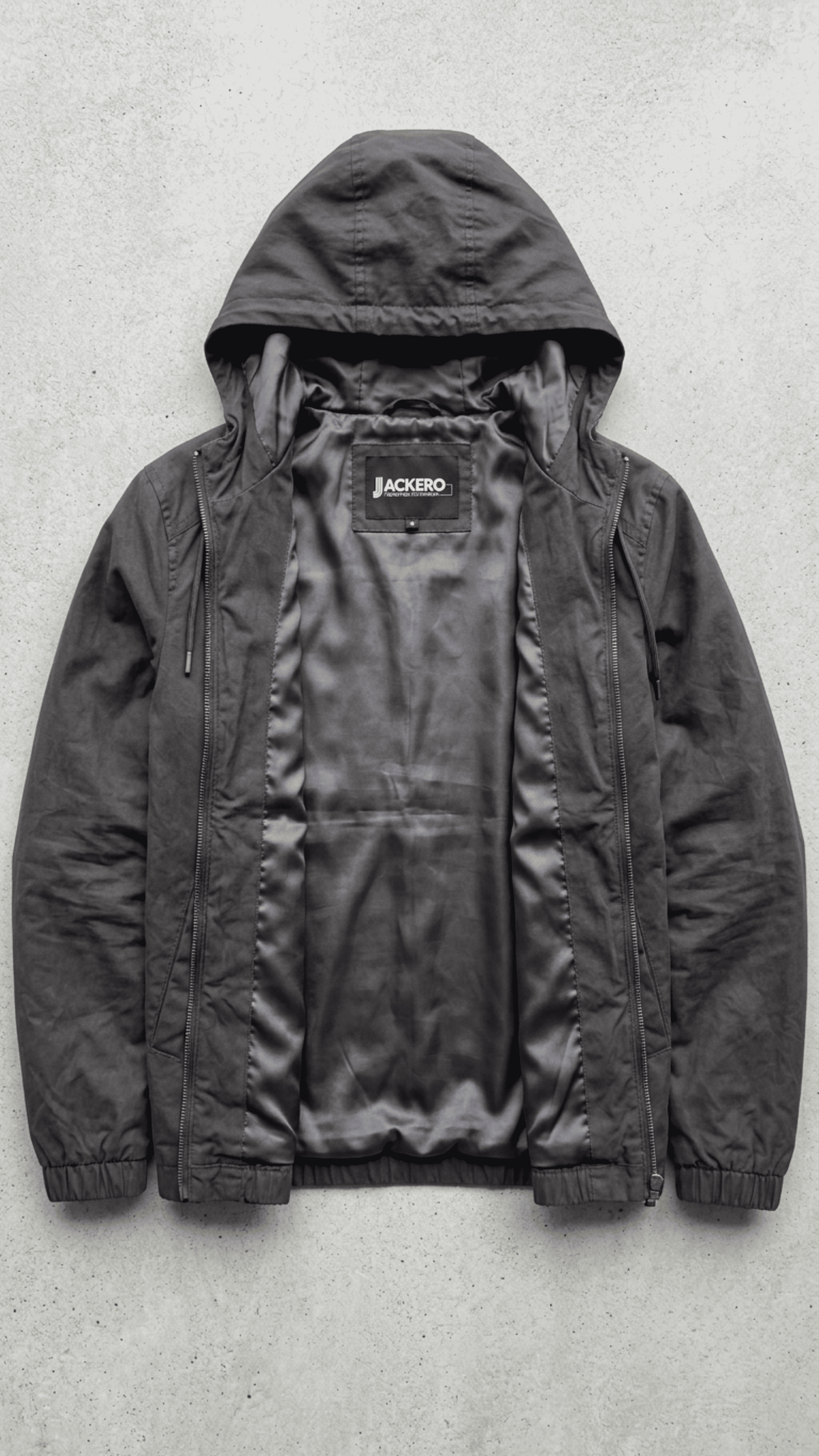 Jackero contemporary dark grey silk cotton hooded outerwear beautifully presented against a clean, minimalist studio backdrop.