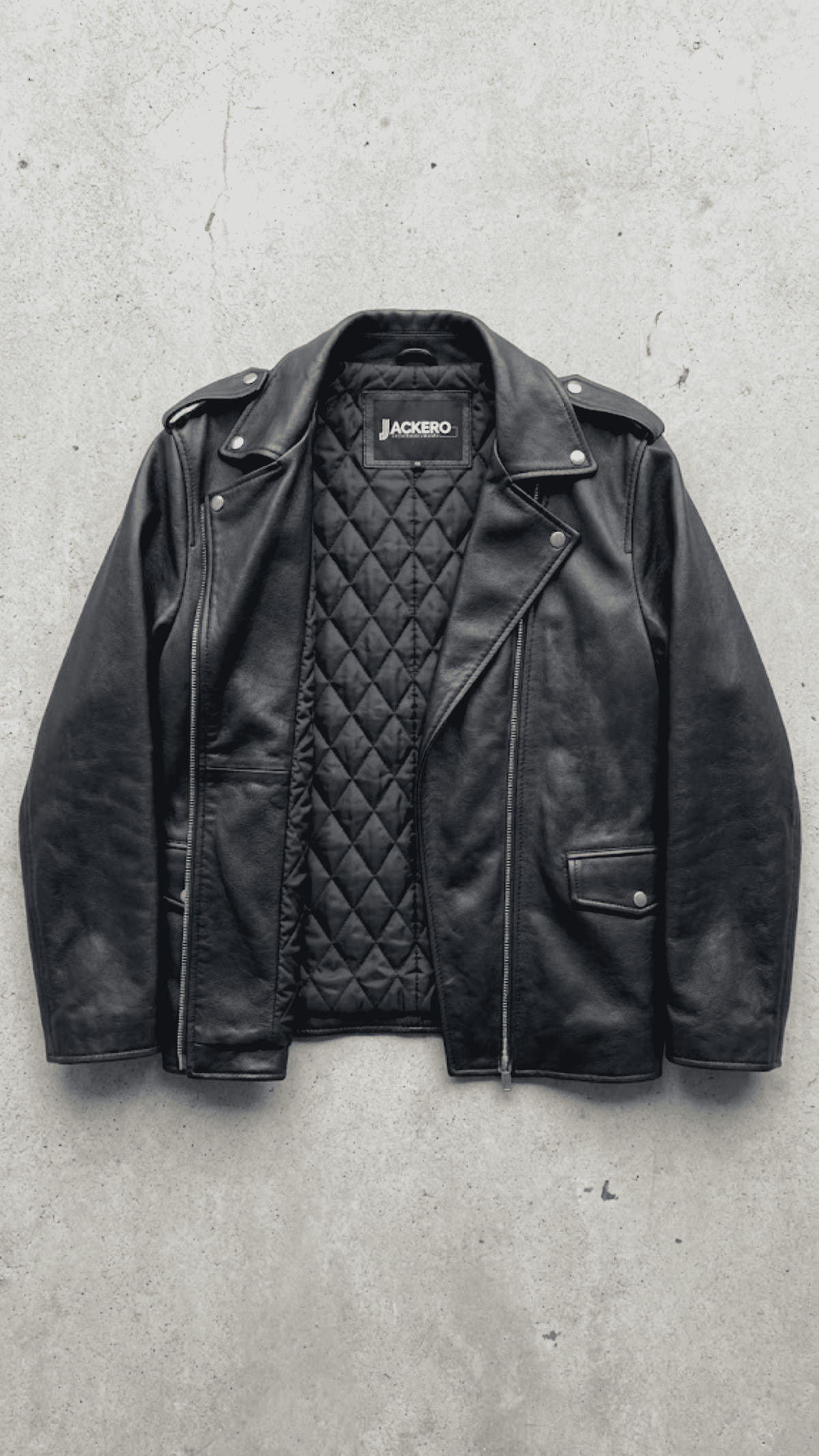 Jackero contemporary darkest black aviator leather baggy oversized jacket presented against a clean, minimalist studio backdrop.