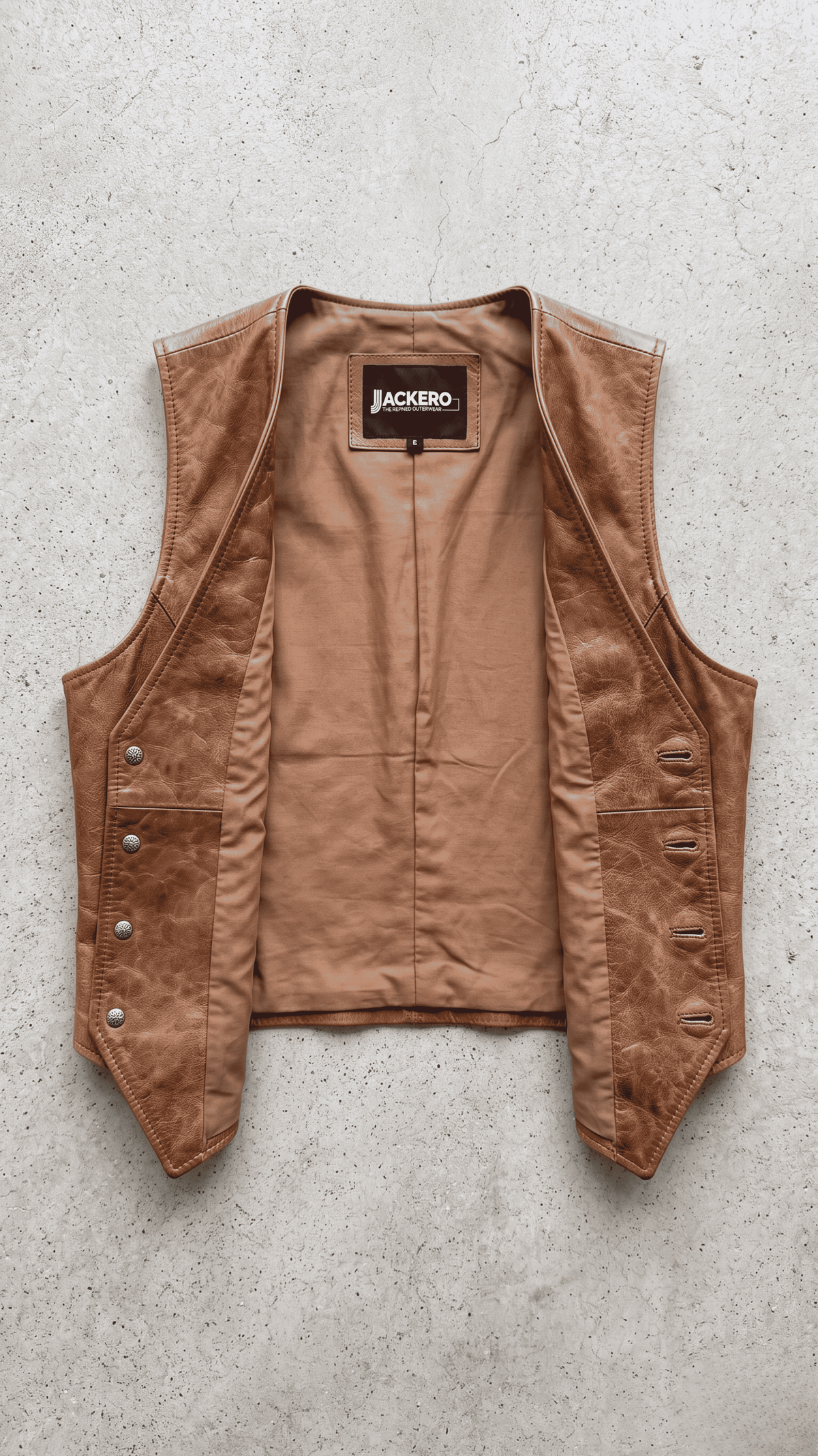 Jackero light brown leather vest outerwear beautifully presented against a clean, minimalist studio backdrop.