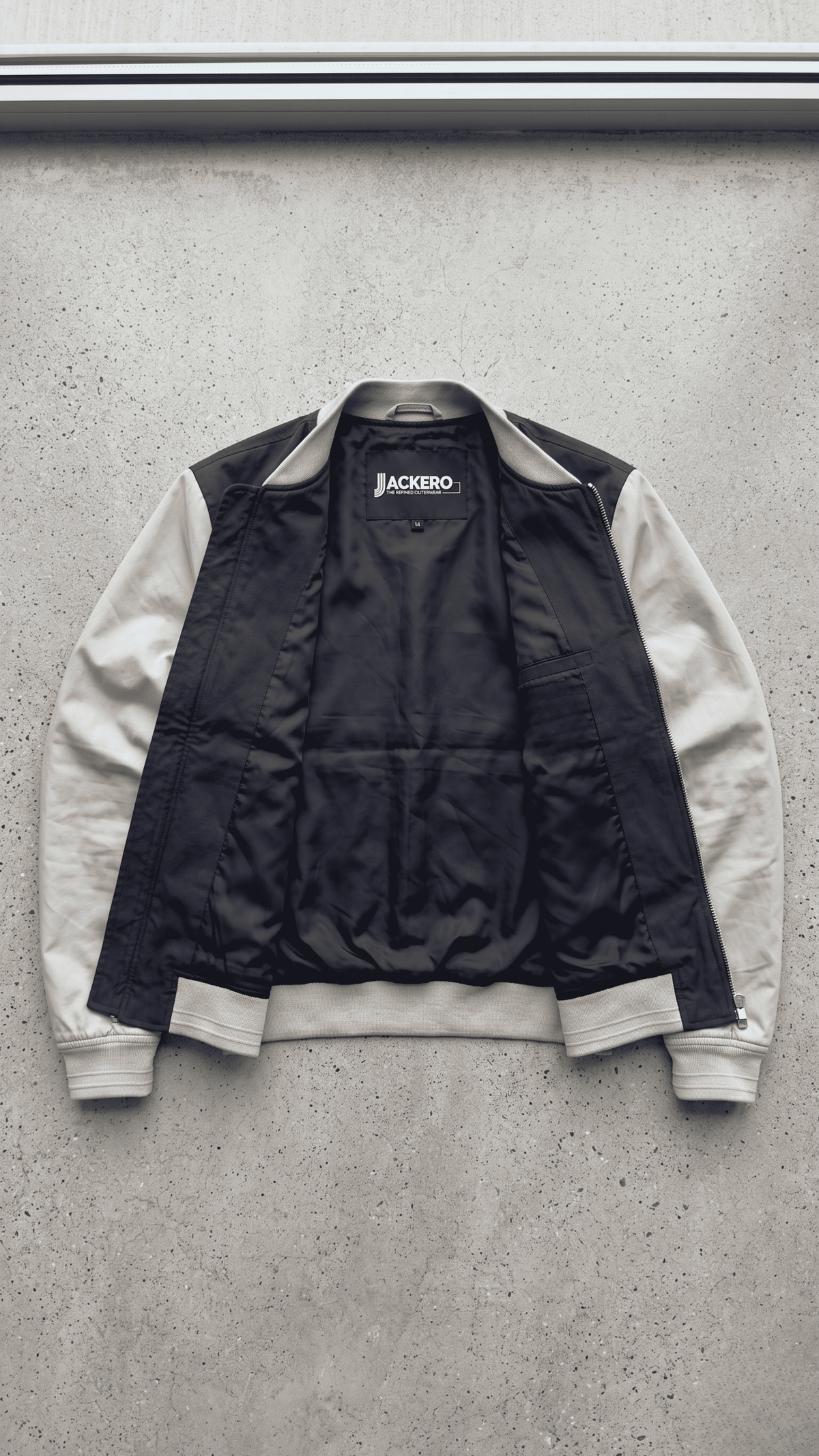 Jackero dark navy blue and grey two-tone cotton jacket perfectly presented against a minimal studio background.