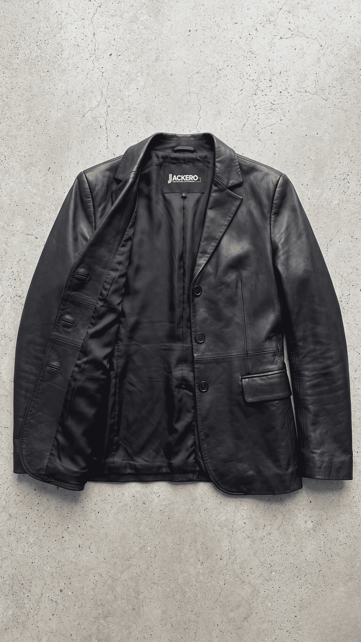 Jackero contemporary women's black leather blazer jacket beautifully presented against a clean, minimalist studio backdrop.