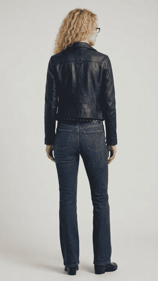 Clean back view of a minimalist black leather biker jacket, highlighting the structured shoulders, tailcoat cut, and tailored fit alignment.