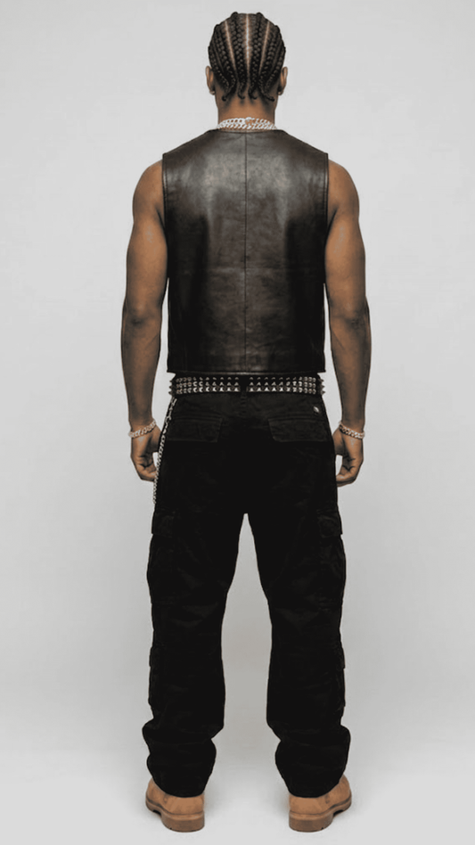 Regular fit men's black leather buttoned gilet displaying functional welt pockets and a clean, comfortable tailored alignment.