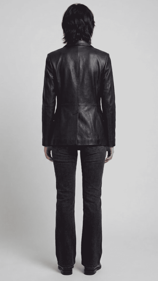 back-angle profile of a regular fit women's black leather dinner jacket displaying smooth drape and premium leather material quality.