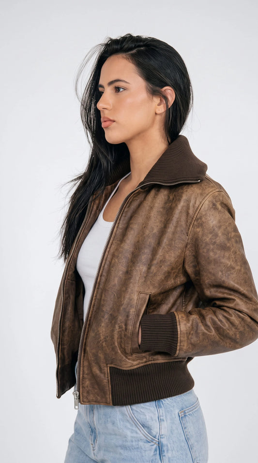 Vintage washed brown cropped leather aviator jacket for women with zip front and knit trim, front view on model