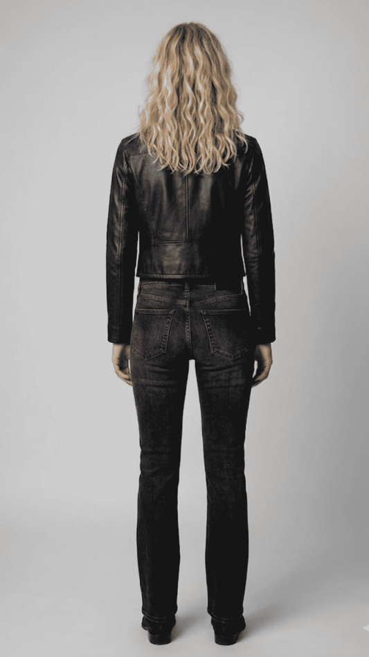 Model showcasing a fitted black genuine leather jacket for a timeless, sophisticated casual look.
