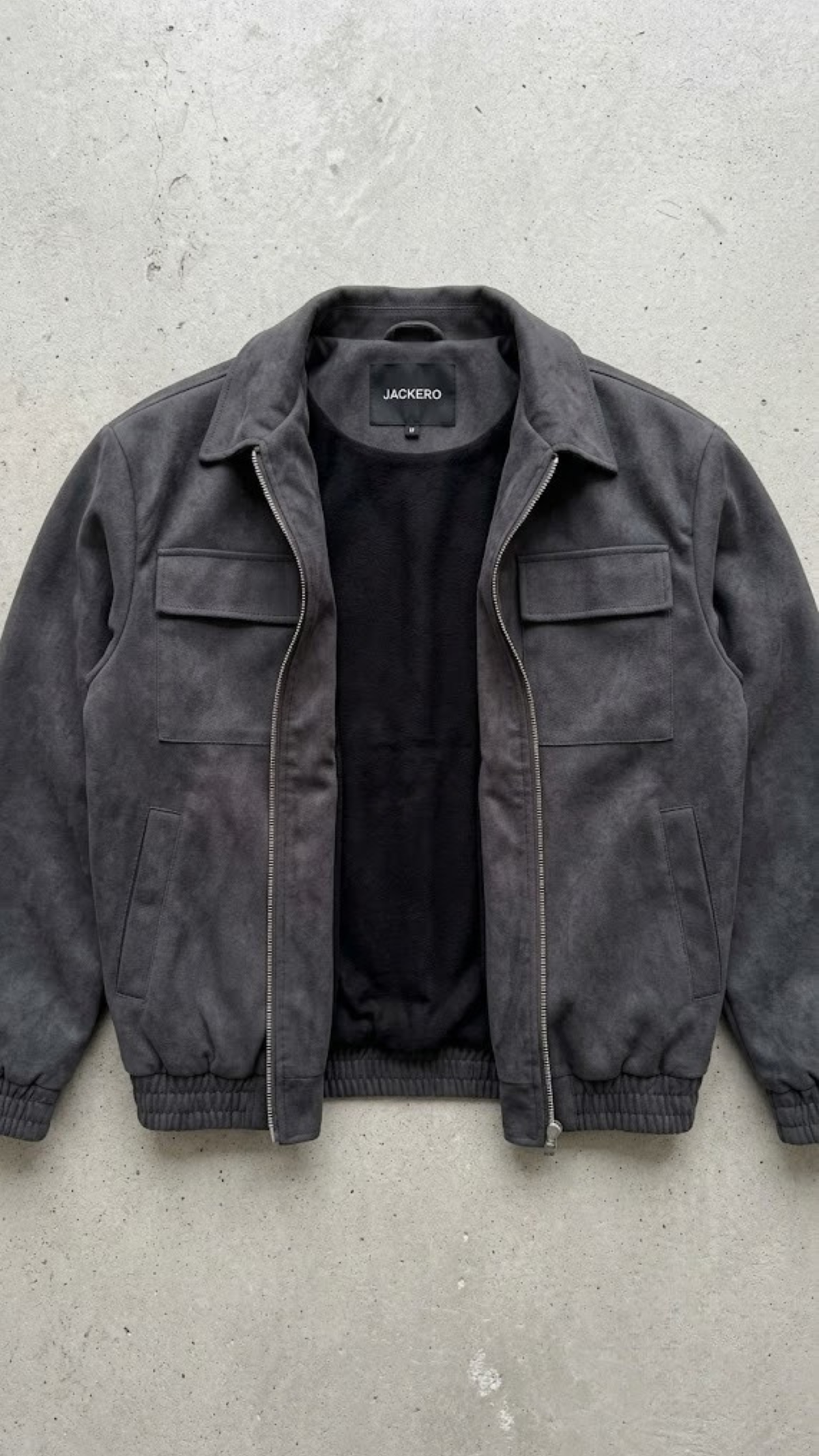 Flat lay studio photography of Jackero premium dark grey suede outerwear