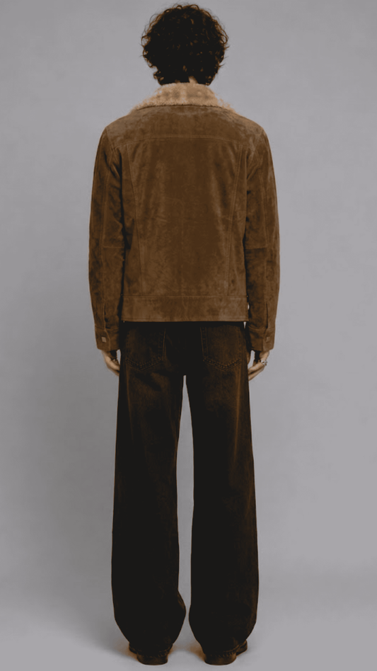 highlighting the rich velvety texture of dark mustard yellow suede paired with soft fur lining along the collar edges.