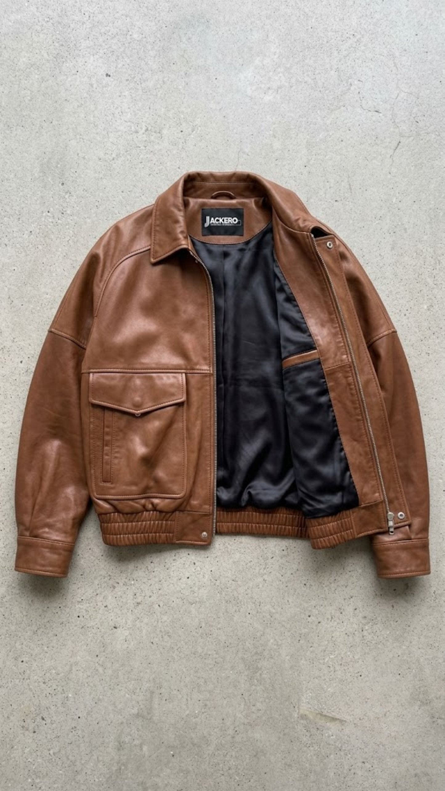 Premium women's cognac tan real leather jacket with large flap pockets for luxury autumn collection.