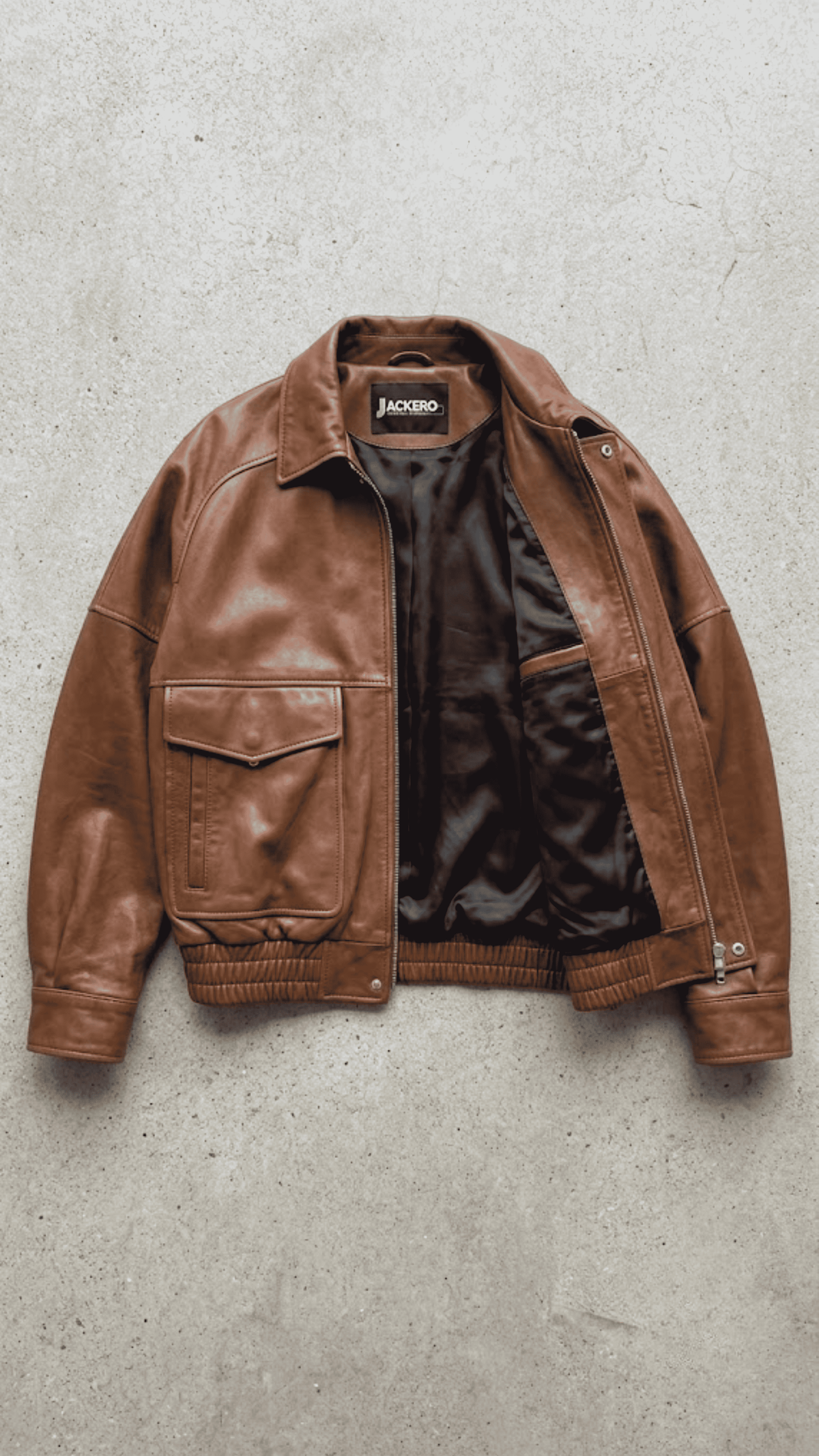 Premium women's cognac tan real leather jacket with large flap pockets for luxury autumn collection.