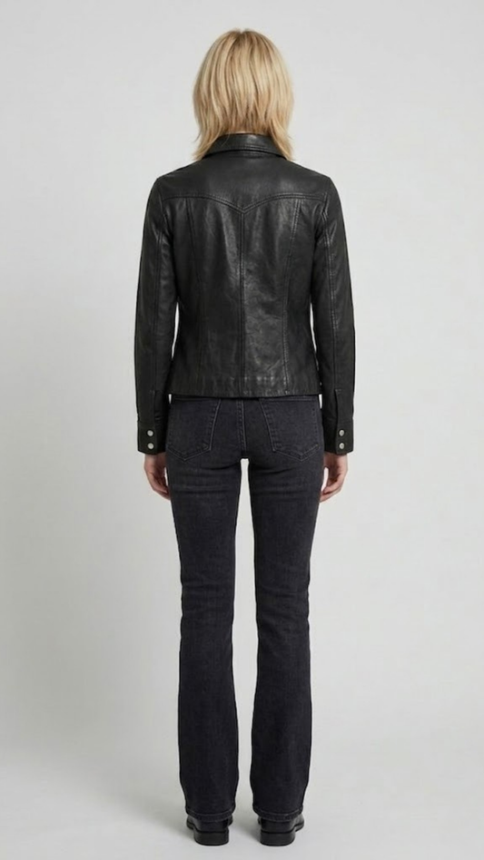 Straight-on back view of a structured premium black leather trucker jacket showcasing its pristine panel alignment and tailored fit.