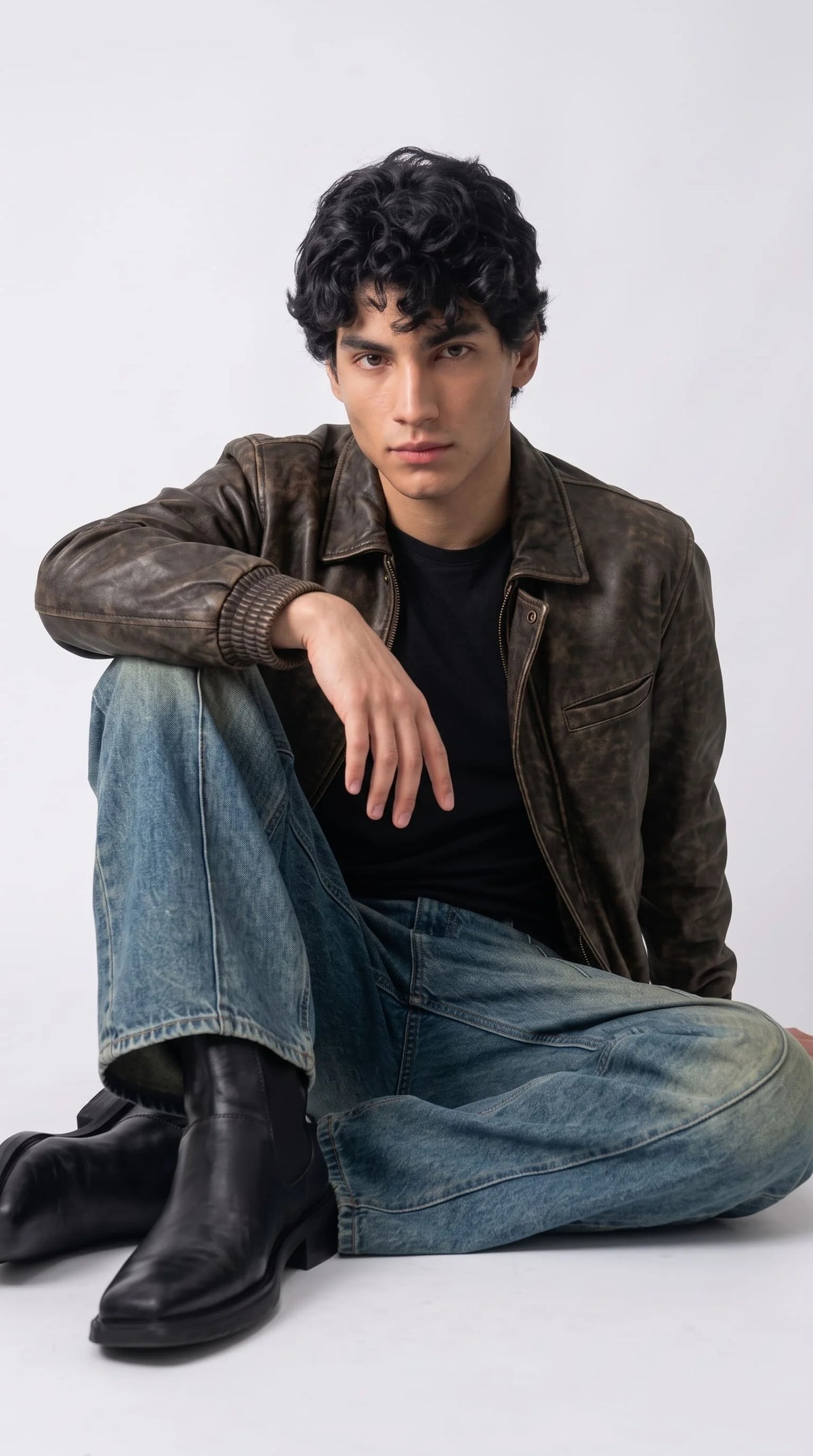 Men's aged brown genuine leather bomber jackero jacket with stand collar, brass zipper, and snap button placket on model