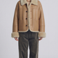 a premium beige leather flight jacket featuring a matching soft cream shearling collar.