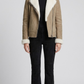 premium jackero beige suede jacket highlighting a clean zipper front and a thick, soft white shearling collar.