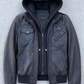 Minimalist studio product flat lay presentation featuring the luxury black hooded leather bomber jacket neatly displayed on a contrasting setup.