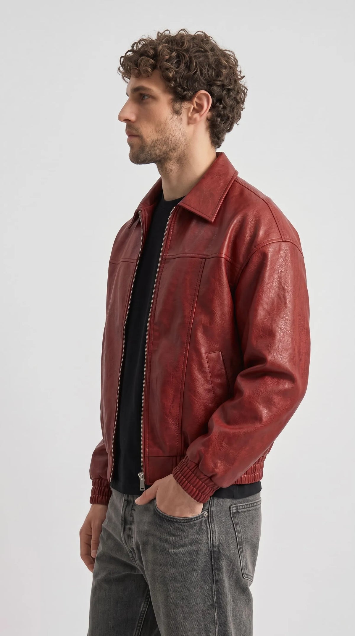 Premium streetwear fashion lookbook featuring a high-quality red leather bomber jacket with front zipper.