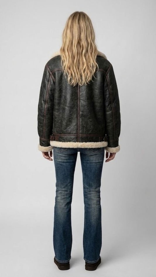 Back panel view of the Jackero premium leather jacket, showcasing tailored fit and the visible cream shearling collar edges.