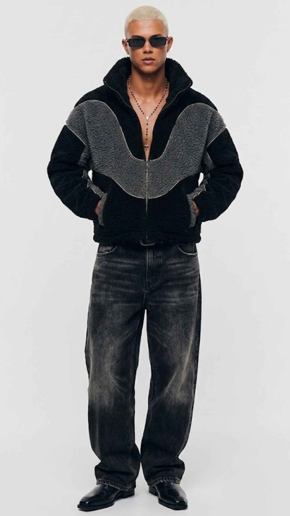 Front view of oversized black and dark grey wool Y2K jacket featuring textured fleece finish and stand-up collar.