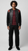 Jackero premium black and red leather bomber jacket highlighting the bold colorblock design and sleek front zipper closure.