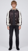 Front full view of premium black and white varsity jacket displaying the striking contrast between the dark body and crisp white sleeves.