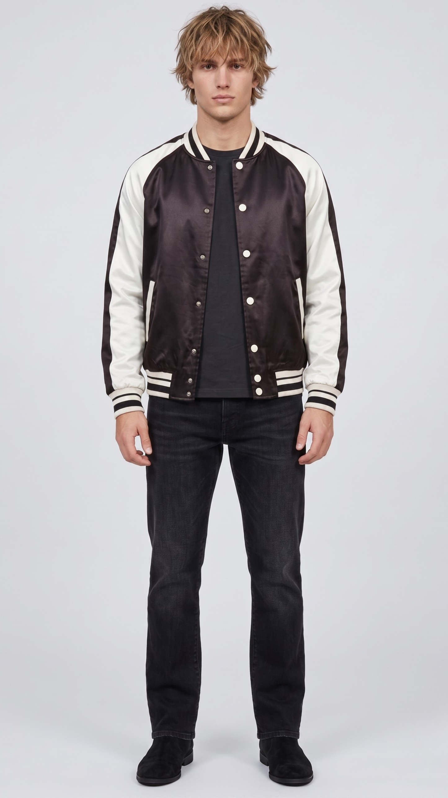 Front full view of premium black and white varsity jacket displaying the striking contrast between the dark body and crisp white sleeves.