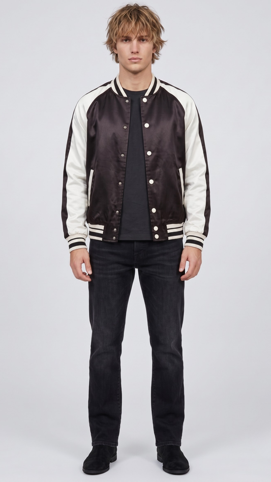 Front full view of premium black and white varsity jacket displaying the striking contrast between the dark body and crisp white sleeves.