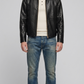 Black crocodile textured leather jacket by Jackero shown from the front view on a studio background.