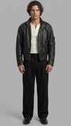Jackero premium black distressed leather jacket showing the unique faded vintage finish and asymmetric front zipper.