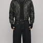 Black distressed leather Y2K jacket with a prominent fur hood shown from the front view.