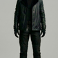 a double-breasted black leather peacoat featuring a prominent black shearling collar and button closures.