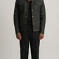 Black leather trucker jacket with a contrasting cream shearling collar shown from the front view.