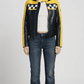 Bold black leather cafe racer jacket by Jackero, featuring distinct vibrant yellow racing stripes on the arms, front studio view.