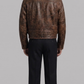 Mens classic aviator jacket made from rugged dark brown distressed leather with a warm cream shearling lining.