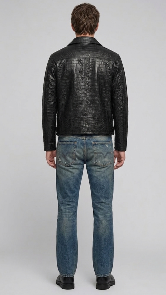 Model wearing a stylish black crocodile textured leather coat paired with blue denim jeans.