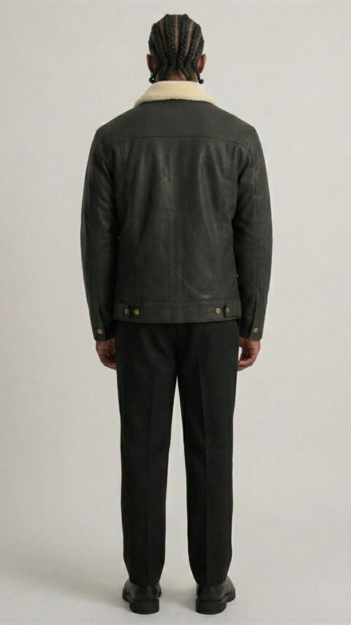 Straight-on back view of Jackero black leather trucker jacket highlighting the clean panel stitching.