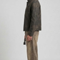 Model wearing a premium textured dark grey distressed leather jacket with regular cuffs