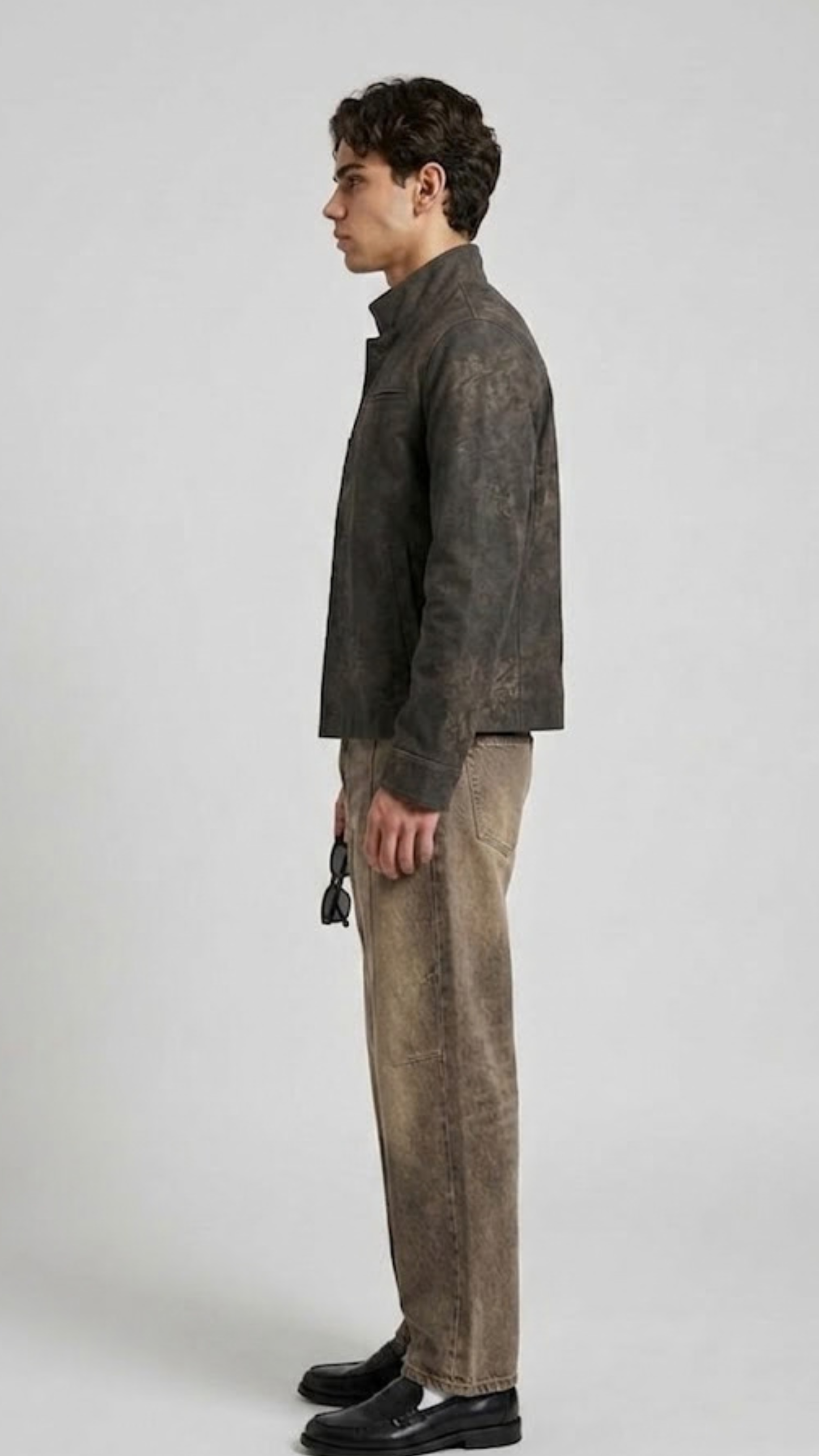 Model wearing a premium textured dark grey distressed leather jacket with regular cuffs