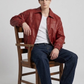 Jackero red leather bomber jacket highlighting the seamless shoulder design.