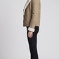 Heavy-duty and cosy beige suede outerwear with full inner shearling insulation, perfect for cold weather styling.