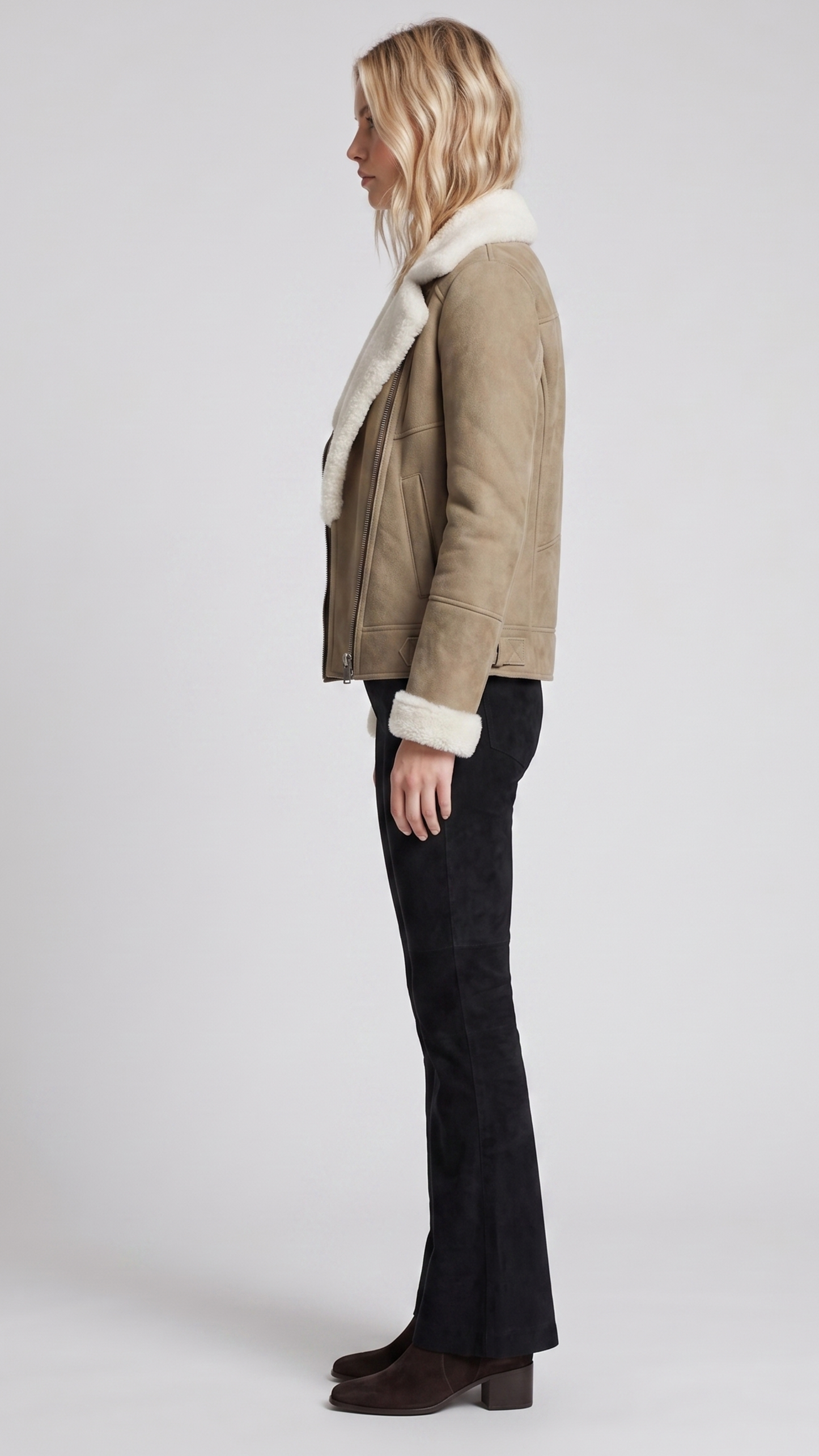 Heavy-duty and cosy beige suede outerwear with full inner shearling insulation, perfect for cold weather styling.