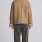 classic aviator jacket crafted from smooth beige leather with a warm, plush cream shearling lining.