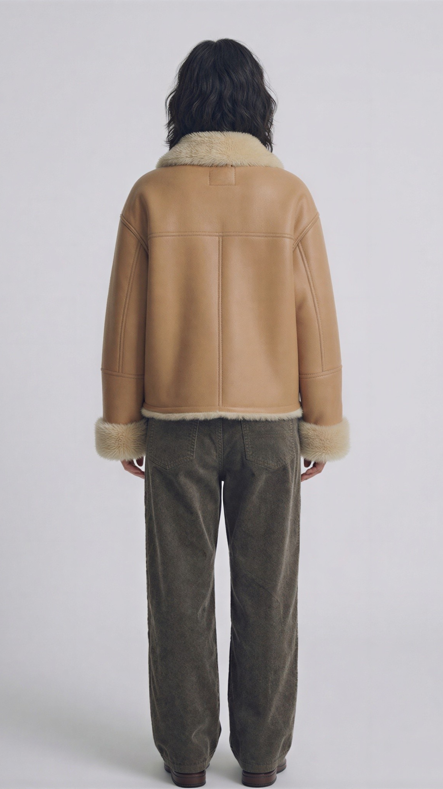 classic aviator jacket crafted from smooth beige leather with a warm, plush cream shearling lining.